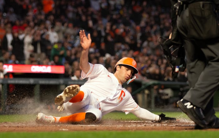 SF Giants shortstop Casey Schmitt slides safely home against the Philadelphia Phillies on May 16, 2023.